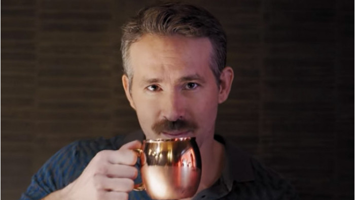 Ryan Reynolds takes aim at Henry Cavill in Movember-inspired gin ad